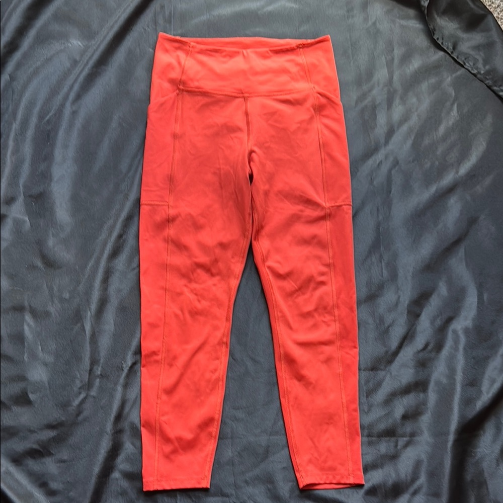 Girlfriend Collective orange red ankle compressive leggings with side pockets